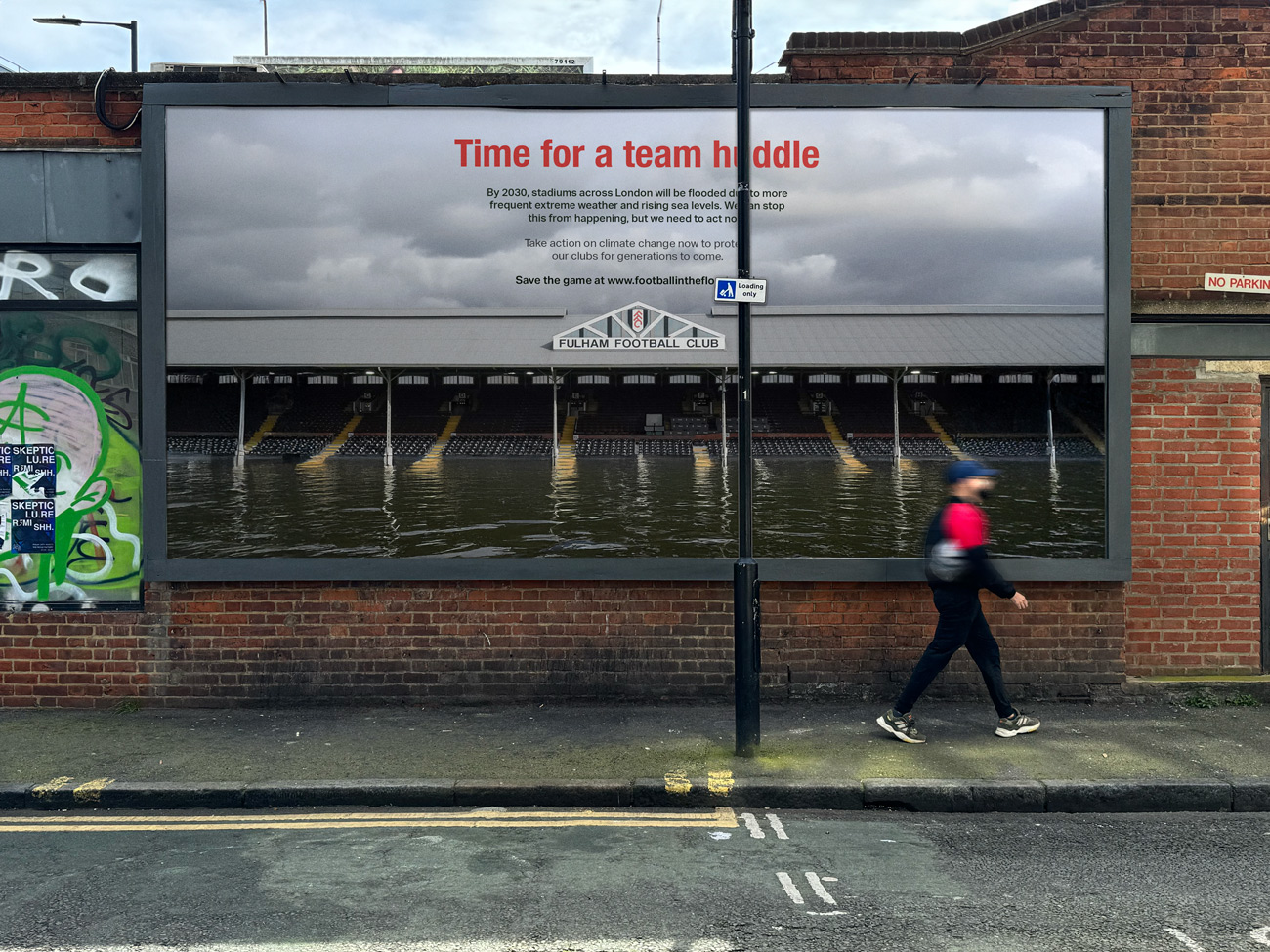 A billboard mockup of a poster showing Fulham's Craven Cottage football ground/stadium flooded