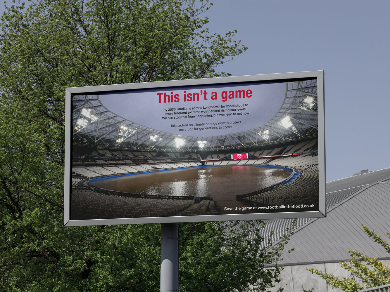 A billboard mockup of a poster showing West Ham's London Stadium football ground/stadium flooded